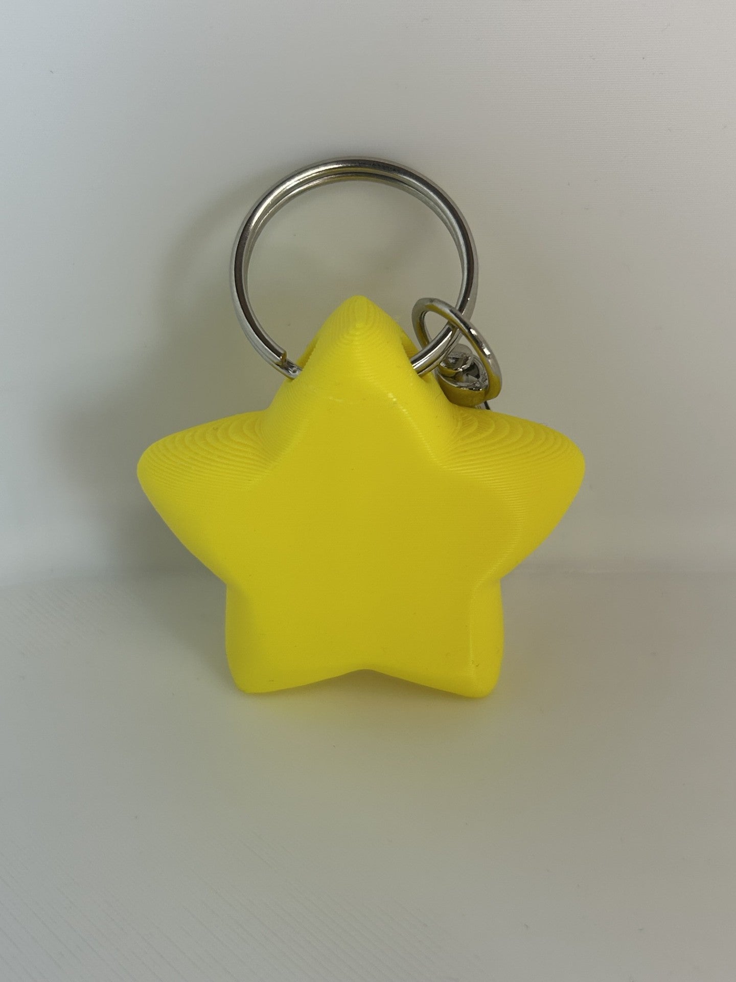 Star Shaped Keychain in yellow with white eyes